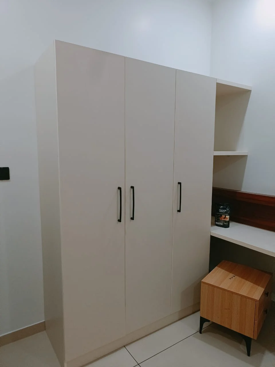 Modern staircase with wooden treads and glass railing